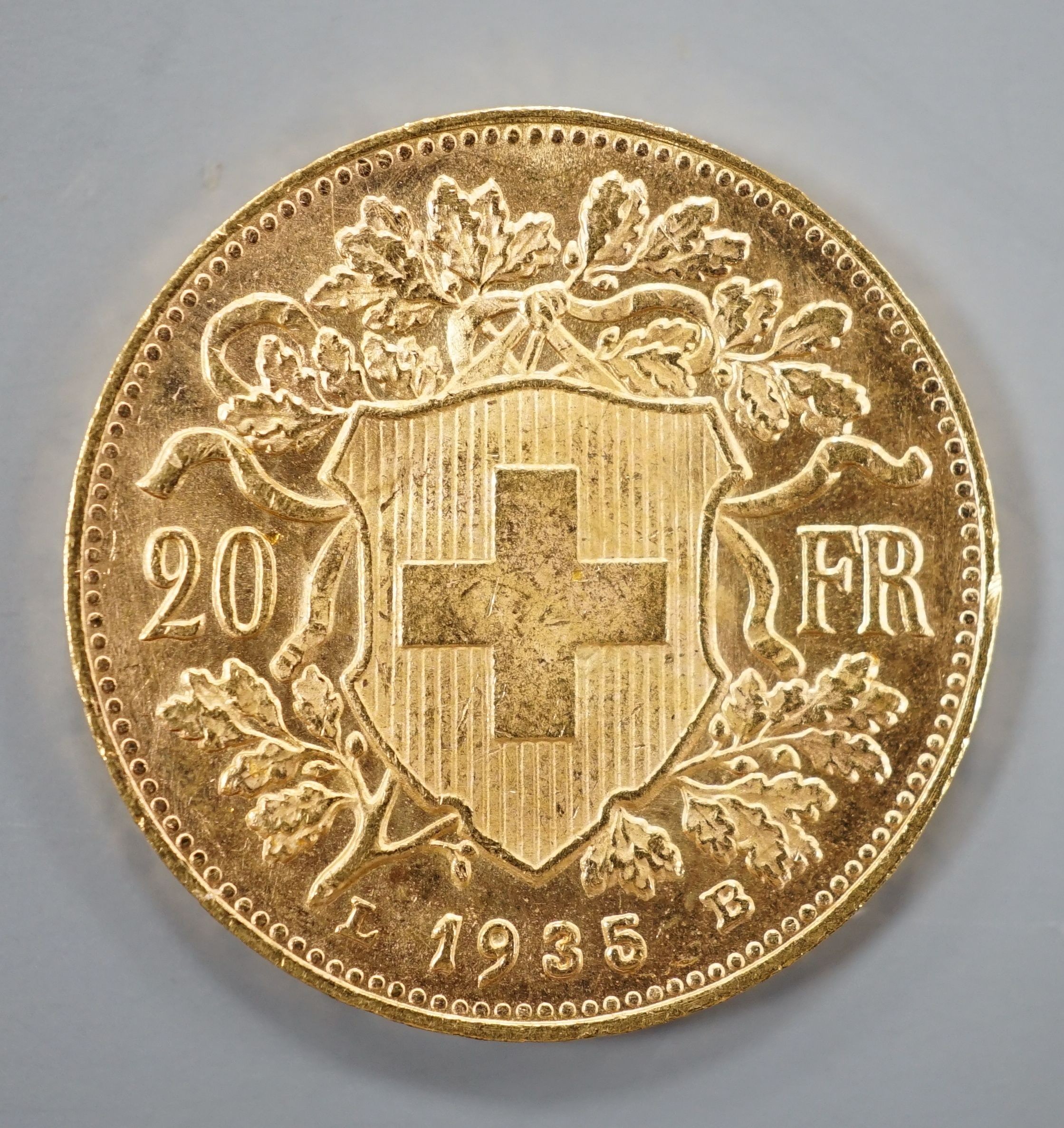 A Swiss 1935 gold 20 francs coin, 6.6 grams